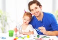 Happy family father and child daughter together draw paints Royalty Free Stock Photo