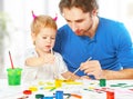 Happy family father and child daughter together draw paints Royalty Free Stock Photo