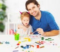 Happy family father and child daughter together draw paints Royalty Free Stock Photo