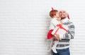 Happy family father and child with gift in Christmas kiss