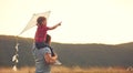 Happy family father and child on meadow with a kite in summer Royalty Free Stock Photo