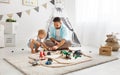 Happy family father and child son playing in toy railway in pl Royalty Free Stock Photo