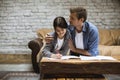 Happy family father and daughter doing homework at home Royalty Free Stock Photo