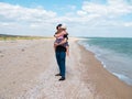 Happy family father daughter hugging on marine landscape. Bearded dad with child in hands having fun together Royalty Free Stock Photo