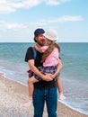 Happy family father daughter hugging on marine landscape. Bearded dad with child in hands having fun together Royalty Free Stock Photo