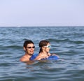 Happy family with father and daughter playing in the sea in summ Royalty Free Stock Photo