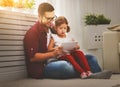 Happy family father and daughter playing with tablet computer Royalty Free Stock Photo