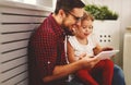 Happy family father and daughter playing with tablet computer Royalty Free Stock Photo