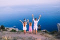 Happy family of four walking in the mountains on the sunset Royalty Free Stock Photo