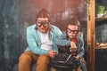 Happy family father and little son playing a video game. child playing video game with console wheel. funny kid with his Royalty Free Stock Photo