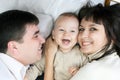 Happy family - father, mother and baby Royalty Free Stock Photo