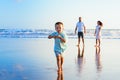 Happy family have fun on sunset beach Royalty Free Stock Photo