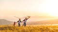 Happy family father, mother and child daughter launch a kite on Royalty Free Stock Photo