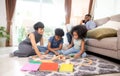 Happy family father and mother and children doing activity playing toy railway with fun in the living room. Royalty Free Stock Photo