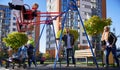 Happy family - father, mother and children having fun together on playground. Royalty Free Stock Photo