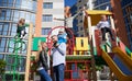 Happy family - father, mother and children having fun together on playground. Royalty Free Stock Photo