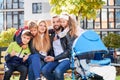 Happy family - father, mother and children having fun together on playground. Royalty Free Stock Photo