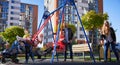 Happy family - father, mother and children having fun together on playground. Royalty Free Stock Photo