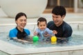 happy family. father and mother with small daughter in swimming pool Royalty Free Stock Photo