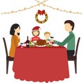Happy family father, mother, son and daughter sitting at home near the table and celebrating Christmas Royalty Free Stock Photo