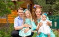 Happy family of father, mother and two children in outdoor on a summer day. Portrait parents and kids on nature. Positive human em