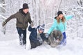 Happy family father, son, mother and pet walking in winter park Royalty Free Stock Photo