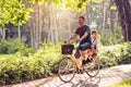 Happy family. Father and son riding bike in the park Royalty Free Stock Photo