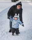 Happy family father and son walking in winter park Royalty Free Stock Photo