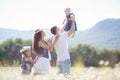 Happy family on a field of blooming daisies Royalty Free Stock Photo