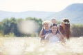 Happy family on a field of blooming daisies Royalty Free Stock Photo