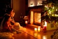 Happy family by a fireplace on Christmas Royalty Free Stock Photo