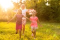 happy family with the flag of america USA at sunset outdoors Royalty Free Stock Photo