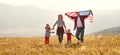 Happy family with flag of america USA at sunset outdoors Royalty Free Stock Photo