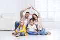 Happy family forming house roof with their hands. Insurance concept Royalty Free Stock Photo