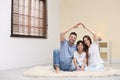 Happy family forming house roof with their hands. Insurance concept Royalty Free Stock Photo