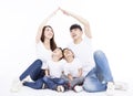 Happy family forming house roof with their hands. Insurance concept Royalty Free Stock Photo