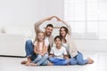 Happy family forming house roof with their hands. Insurance concept Royalty Free Stock Photo