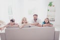 Happy family of four. Blond mom and small girl, brunet dad and l Royalty Free Stock Photo