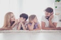 Happy family of four. Blond mom and small son, brunet bearded da Royalty Free Stock Photo