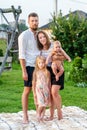 Happy family of four having fun together resting.on blanket at summer Royalty Free Stock Photo