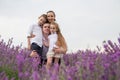 Happy family of four in lavender field