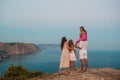 Happy family of four walking in the mountains on the sunset Royalty Free Stock Photo