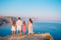 Happy family of four walking in the mountains on the sunset Royalty Free Stock Photo