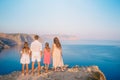 Happy family of four walking in the mountains on the sunset Royalty Free Stock Photo