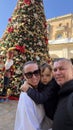 Happy family in front of the Christmas tree, Valletta, Malta Royalty Free Stock Photo