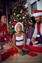 Happy family in front of decorated Christmas tree have fun Royalty Free Stock Photo