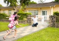 Happy family in front of house