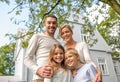 Happy family in front of house outdoors Royalty Free Stock Photo