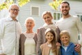 Happy family in front of house outdoors Royalty Free Stock Photo