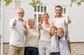 Happy family in front of house outdoors Royalty Free Stock Photo